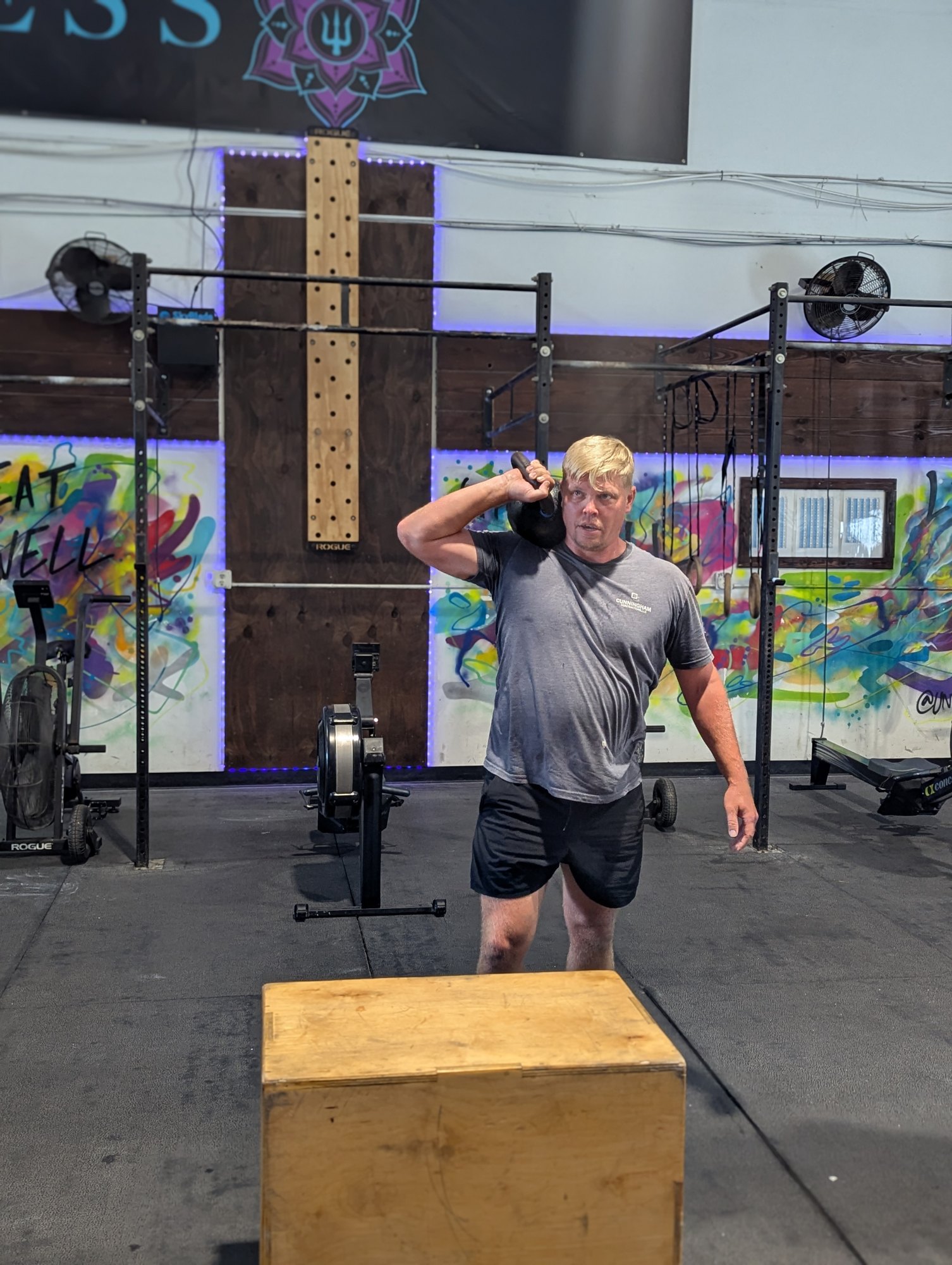 A Nomad Fitness member practicing a dumbbell step-up on James Island
